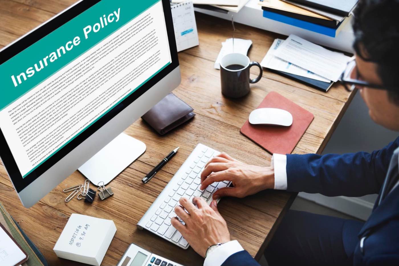 For an online business (entrepreneur checking insurance conditions, important research, office)